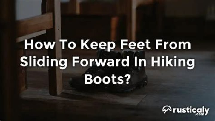 How do I keep my feet from sliding forward in hiking boots?