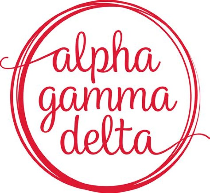 Who is the current international president of Alpha Gamma Delta?